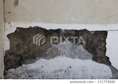 Weathered exterior wall showing damage and deterioration 131778890