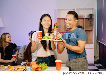 Group of Young Asian friend having, enjoy evening party together at home. 131778909