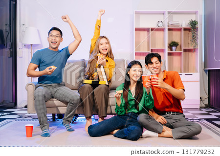 Celebration with friends enjoying food, drinks, and laughter at a lively house party. Perfect for themes of joy 131779232