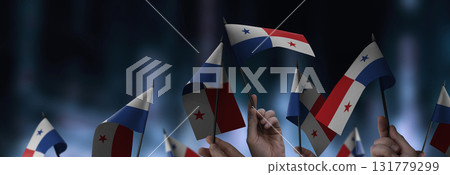 Panama flags in their hands on a blurred urban background 131779299