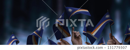 Marshall flags in their hands on a blurred urban background Marshall flags in their hands on a blurred urban background 131779307