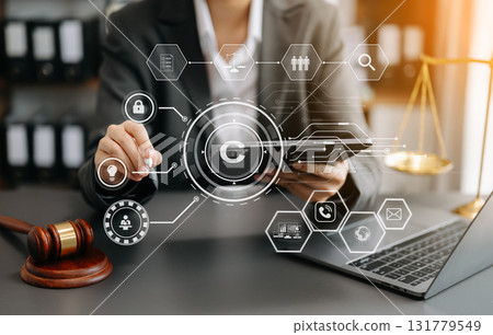Copyright or patent concept, Person hand using laptop computer, tablet and smartphone with virtual screen copyright icon trademark, Creation ownership against piracy. 131779549
