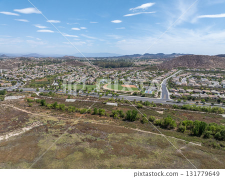 Aerial view of a sprawling neighborhood of family homes in Menifee, California, USA. 131779649