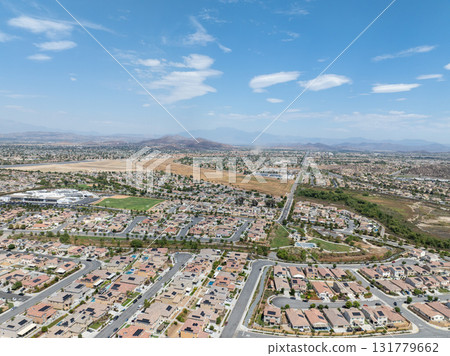 Aerial view of a sprawling neighborhood of family homes in Menifee, California, USA. Aerial view of a sprawling neighborhood of family homes in Menifee, California, USA. 131779662