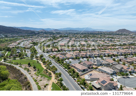 Aerial view of a sprawling neighborhood of family homes in Menifee, California, USA. Aerial view of a sprawling neighborhood of family homes in Menifee, California, USA. 131779664