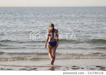 Young woman on the beach Young woman on the beach 131780116