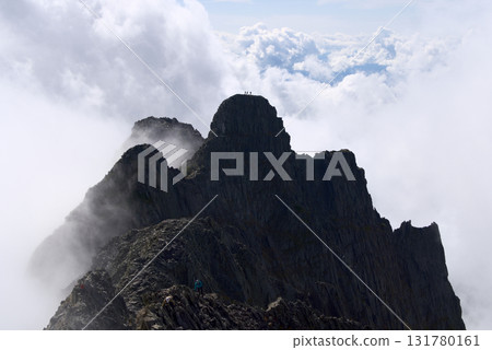 Gendarme among the clouds as seen from Mount Okuhotaka in the Northern Alps Gendarme among the clouds as seen from Mount Okuhotaka in the Northern Alps 131780161