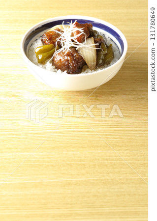 Sweet and sour pork bowl with black vinegar 131780649