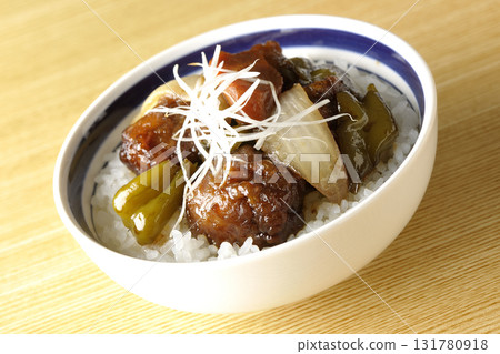 Sweet and sour pork bowl with black vinegar 131780918