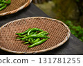 Shishito peppers in a colander 131781255