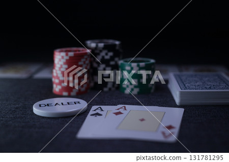 the poker game in casino chips cards and the poker table the poker game in casino chips cards and the poker table 131781295