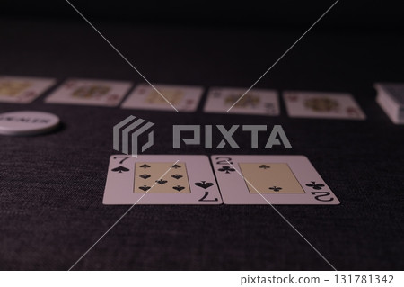 the poker game in casino chips cards and the poker table 131781342