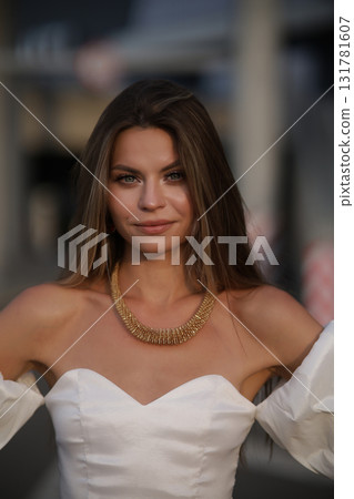 Woman posing on the road wearing fashionable clothes Woman posing on the road wearing fashionable clothes 131781607