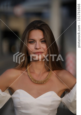 Woman posing on the road wearing fashionable clothes 131781608