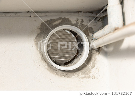 Drill a Hole Through Concrete Wall For Bathroom Air Duct. 131782167