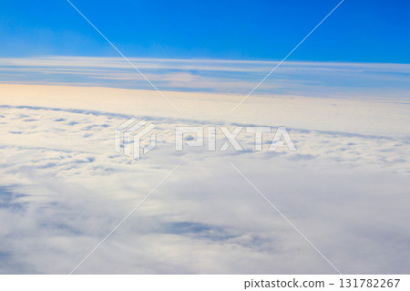 Beautiful white clouds in blue sky. View from airplane 131782267