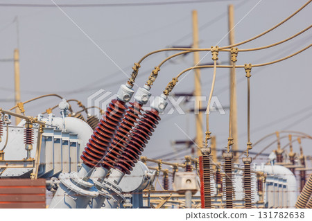 High voltage ceramic insulators on towers in Power Substation. 131782638
