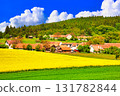 A beautiful rapeseed field in Bohemia and a cumulonimbus cloud composite 131782844