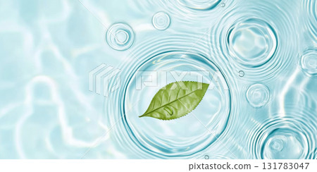 A green leaf floating on water showing ripples and bubbles, suitable as SPA background 131783047