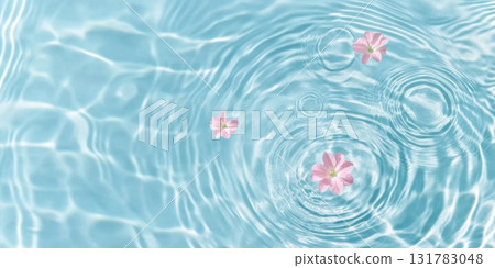Pink flowers floating on water surface with ripples, perfect for SPA background 131783048