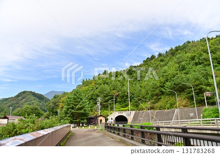 A view of the Asakawa Dam's top passage and a public road tunnel 131783268