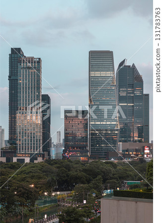 the high-rise buildings of the One Bangkok and Dusit Central Park developments with Lumphini Park in the foreground. 131783763