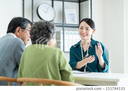 Senior couple consulting with a planner Senior couple consulting with a planner 131784133