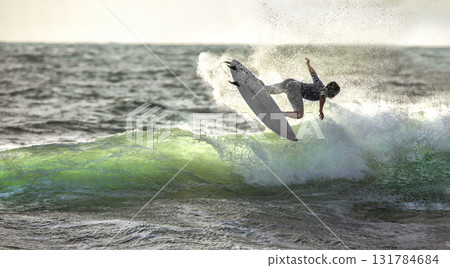 Surfer ride the wave  IN JUMP,   slashes 131784684