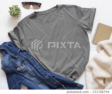 Blank gray unisex t-shirt near accessories on white wooden board top view, Mockup Blank gray unisex t-shirt near accessories on white wooden board top view, Mockup 131786744