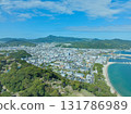 Aerial view of downtown Sumoto City, with the mountains visible 131786989