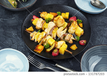 Chicken meat with pineapple on skewers. Chicken meat with pineapple on skewers. 131787203