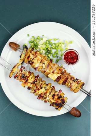Grilled vegetable bacon kebabs. 131787229