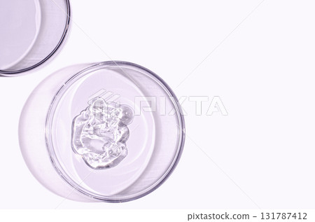 A sample of skin serum or moisturizing gel in a Petri dish. A cosmetic product. Copy space A sample of skin serum or moisturizing gel in a Petri dish. A cosmetic product. Copy space 131787412