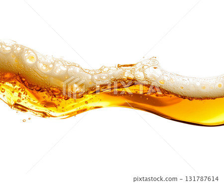 A splash of yellow beer is poured into a clear glass, creating white foam on a white background. 131787614