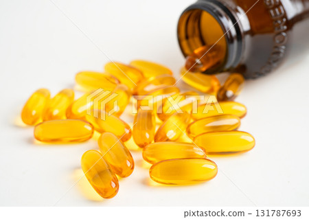 Fish oil or Cod liver oil gel in capsules with omega 3 vitamins, supplementary healthy food. 131787693