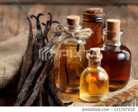 A still life composition featuring dried vanilla bean pods next to small glass bottles containing homemade vanilla extract or essential oil on burlap. AI Generated A still life composition featuring dried vanilla bean pods next to small glass bottles containing homemade vanilla extract or essential oil on burlap. AI Generated 131787819