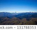 Panoramic view of Caucasus Mountains with snow-capped peaks , hills under blue sky. Natural landscape symbolizing freedom, purity, beauty of wild nature. For travel, adventure, eco-tourism concepts. 131788353