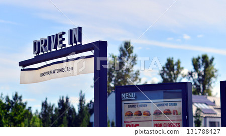 Warsaw, Poland. 11 August 2025. Urban landscape. Neon sign with the inscription: Driver in. Warsaw, Poland. 11 August 2025. Urban landscape. Neon sign with the inscription: Driver in. 131788427