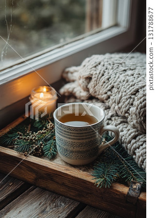 Cozy Scandinavian Winter Tea Ritual with Candle and Knit Blanket 131788677