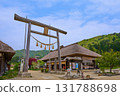 Fresh greenery in Shimogo Town, Minamiaizu County, Fukushima Prefecture. The first torii gate of Takakura Shrine in Ouchijuku, with its thatched roof. 131788698