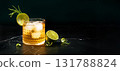 Alcoholic or non-alcoholic cocktail with lime and rosemary on dark marble table 131788824