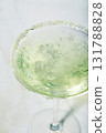 Martini cocktail with ice and slice of lime on marble table background. Alcoholic cocktail or non-alcoholic mocktail. 131788828