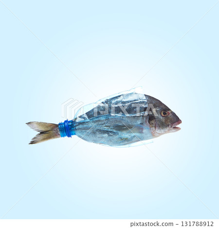 Fish enclosed in transparent plastic bottle concept of ocean pollution 131788912