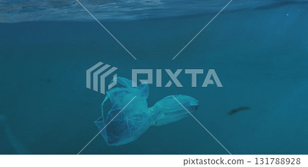 Plastic bag floating underwater in deep blue ocean Plastic bag floating underwater in deep blue ocean 131788928