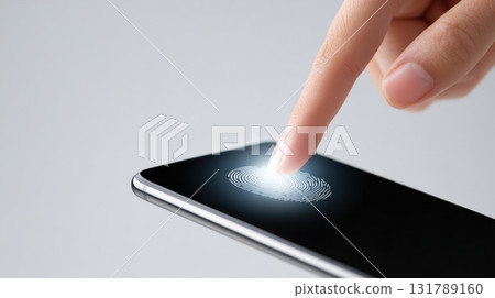 Close up of human finger scanning fingerprint on smartphone screen for security access. Focused interaction showing modern biometric technology for personal identification 131789160