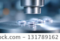 Closeup of pharmaceutical machine sealing vial during vaccine production. medical manufacturing process showing precision technology and hope for healthy future 131789162
