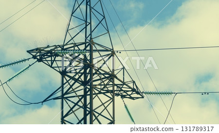 A High Voltage Power Line Tower Stands Tall Against a Beautiful Blue Sky Background A High Voltage Power Line Tower Stands Tall Against a Beautiful Blue Sky Background 131789317