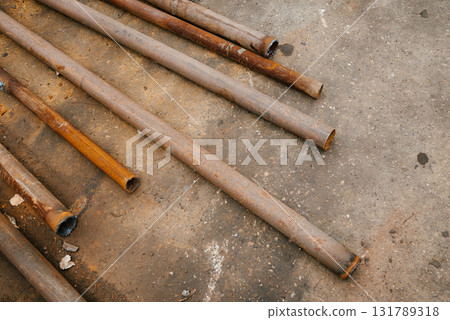 Rusty Steel Pipes on Concrete Surface Layout 131789318