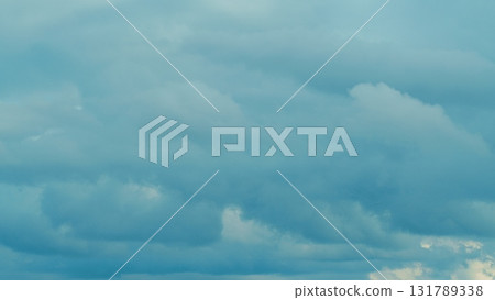 Dramatic and Beautiful Clouds Overhead Captured in a Vibrant and Bright Blue Sky 131789338
