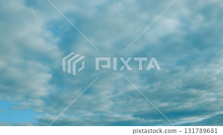 The Beautiful Cloudy Sky Overhead presents a stunning and serene view of the atmosphere above 131789681